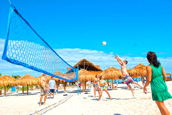 Stay Active Playing Valley Ball at one of our Stops on the best Cozumel bar hop excursion